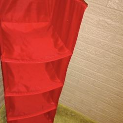 6-compartment hanging closet organizer in red.