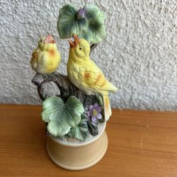 vintage Shafford porcelain music box featuring two yellow canary birds on a tree branch