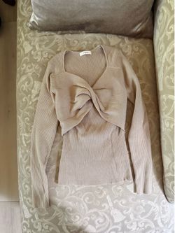 beige ribbed knit long sleeve top with a twist detail #twist #knit lux brand from Korea