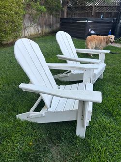 Two white Adirondack chairs