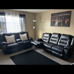 Ashley Furnitures Black Leather Reclining Couch Set.