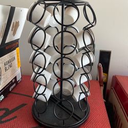 Keurig K-Cup Pod Carousel filled with single-serve coffee capsules.  With a bunch of coffee capsules