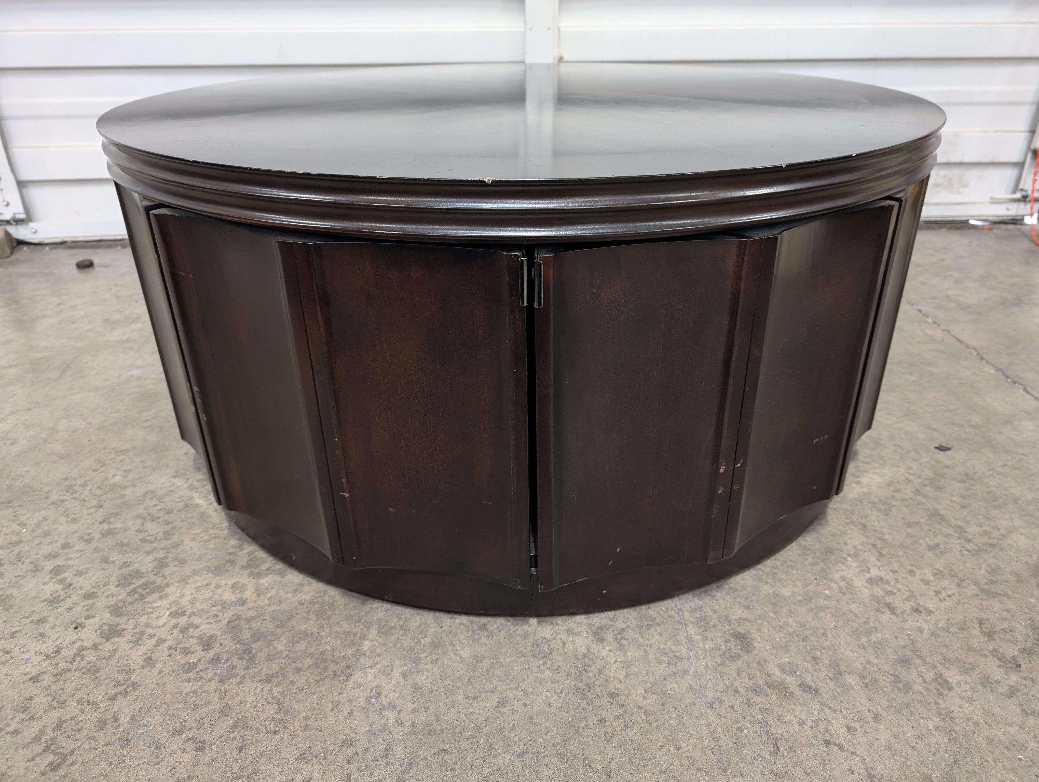 Circular Dark Wood Coffee Table with Paneled Sides