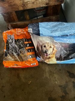 Free Kirkland Signature Salmon & Sweet Potato Formula for Cats and Kirkland Signature Chicken & Rice Formula for Dogs.  Cat food 1/3 left Dog food 1/4