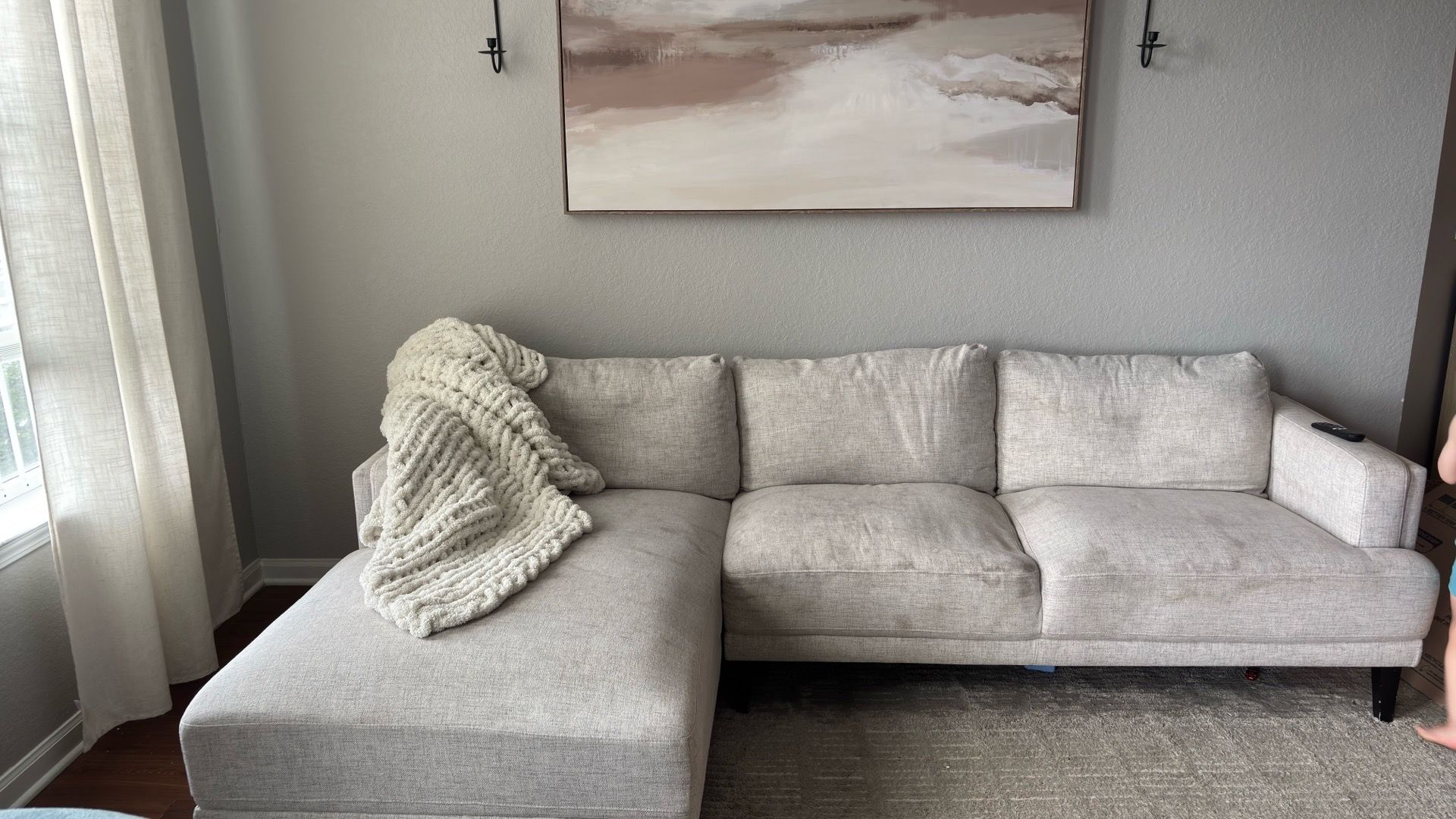 Sofa with chaise. Seats three. Needs cleaning