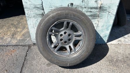 One dodge Dakota 16 Inch aluminum wheel And old tire 6 On 4.5 Lug pattern