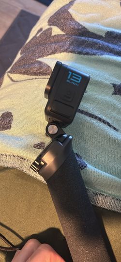 Used once GoPro hero 13. Water proof. With mouth attachment and handle for underwater.  Plus memory card