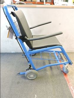 Staxi Patient Transport Chair, featuring a blue frame, black upholstery, and a unique brake system.