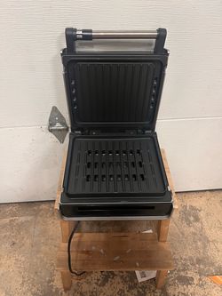 George Foreman steel grill press