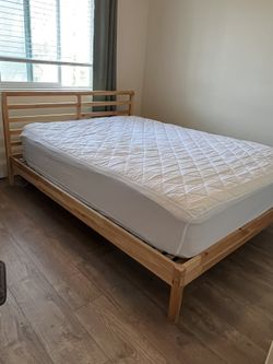 Full size wood bed and mattress (like new!)