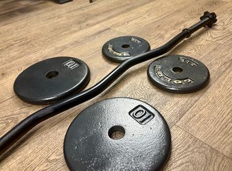 BRAND NEW: Standard Black Curl Bar with Cast Iron Weight Plates of 25s, 10s and 5 lbs. Total= 94 lbs