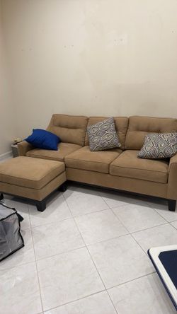Beige pull out sofa bed with ottoman