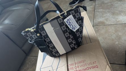 Little purse new located in Mesa Main & Gilbert Rd