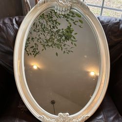 Large pearlescent oval mirror