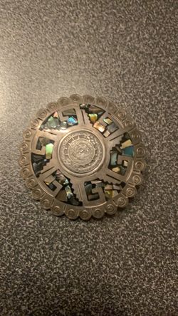 vintage Taxco Mexican sterling silver brooch and pendant combination featuring colorful iridescent abalone shell inlay.