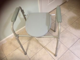 Adult portable toilet , good condition , up to 350 lbs , 158 kg .