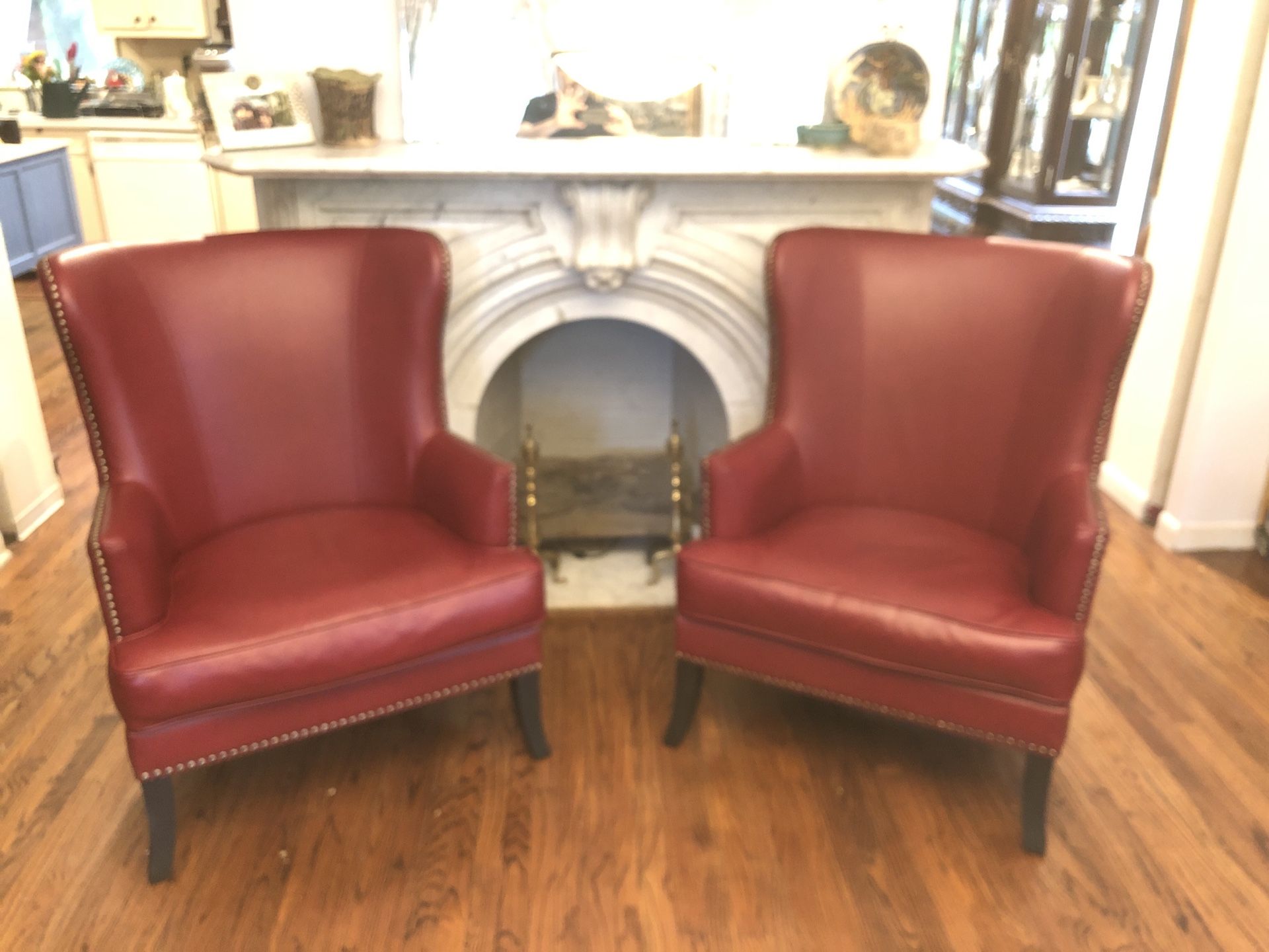 Red pleather wingback chairs