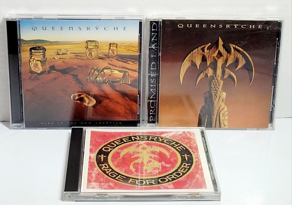 (Lot Of 3) 1986 Queensrÿche Rage for Order/Promised Land/Hear The Now Frontier. Disc Scratches. Queensrÿche is an American progressive metal band form