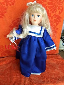 Porcelain graduation doll