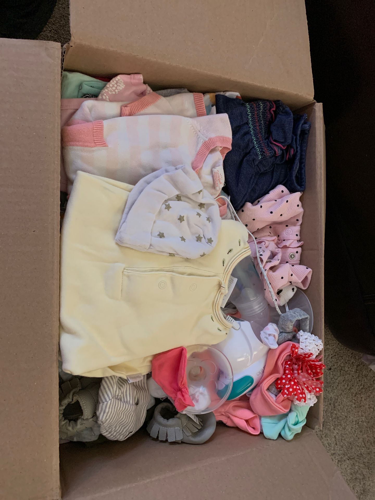 Box full of infant girls clothing