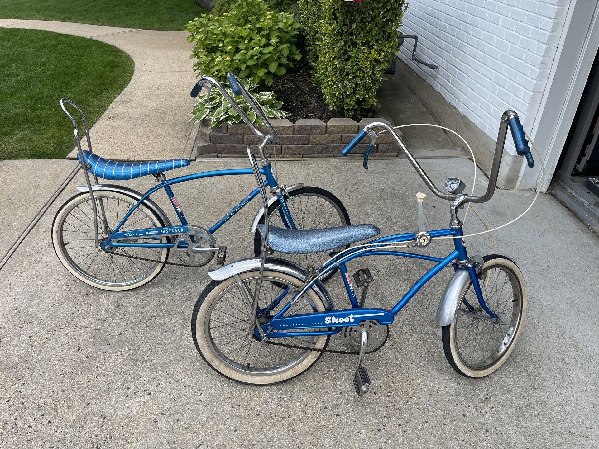2 blue vintage bikes.Schwinn Stingray Fastback, And RollFast Scoot 3 Speed
