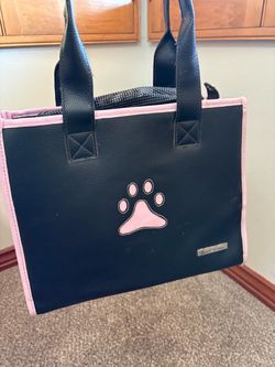 Pet Life Posh Paw Pet Carrier, featuring a sleek black leatherette finish accented with pink trim