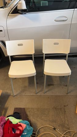 Two White Chairs - Stackable