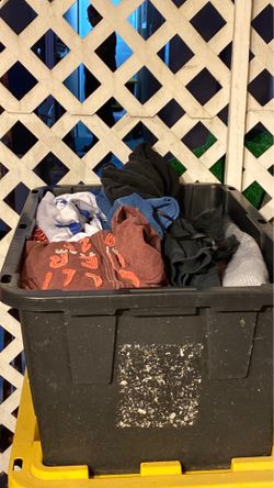 6 black bins full of clothes