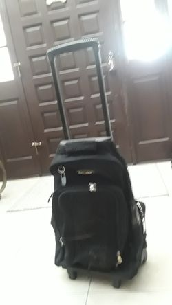 Traveling carrying bag with handle and wheels