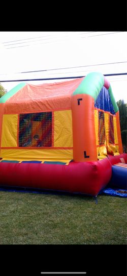 Commercial bouncer house…pic is similar when new. We used it like two years for the kids. includes blower. $600