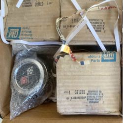 GM boxes new old stock plastic cross flag center caps for 76 to 79 corvettes with factory aluminum wheels
