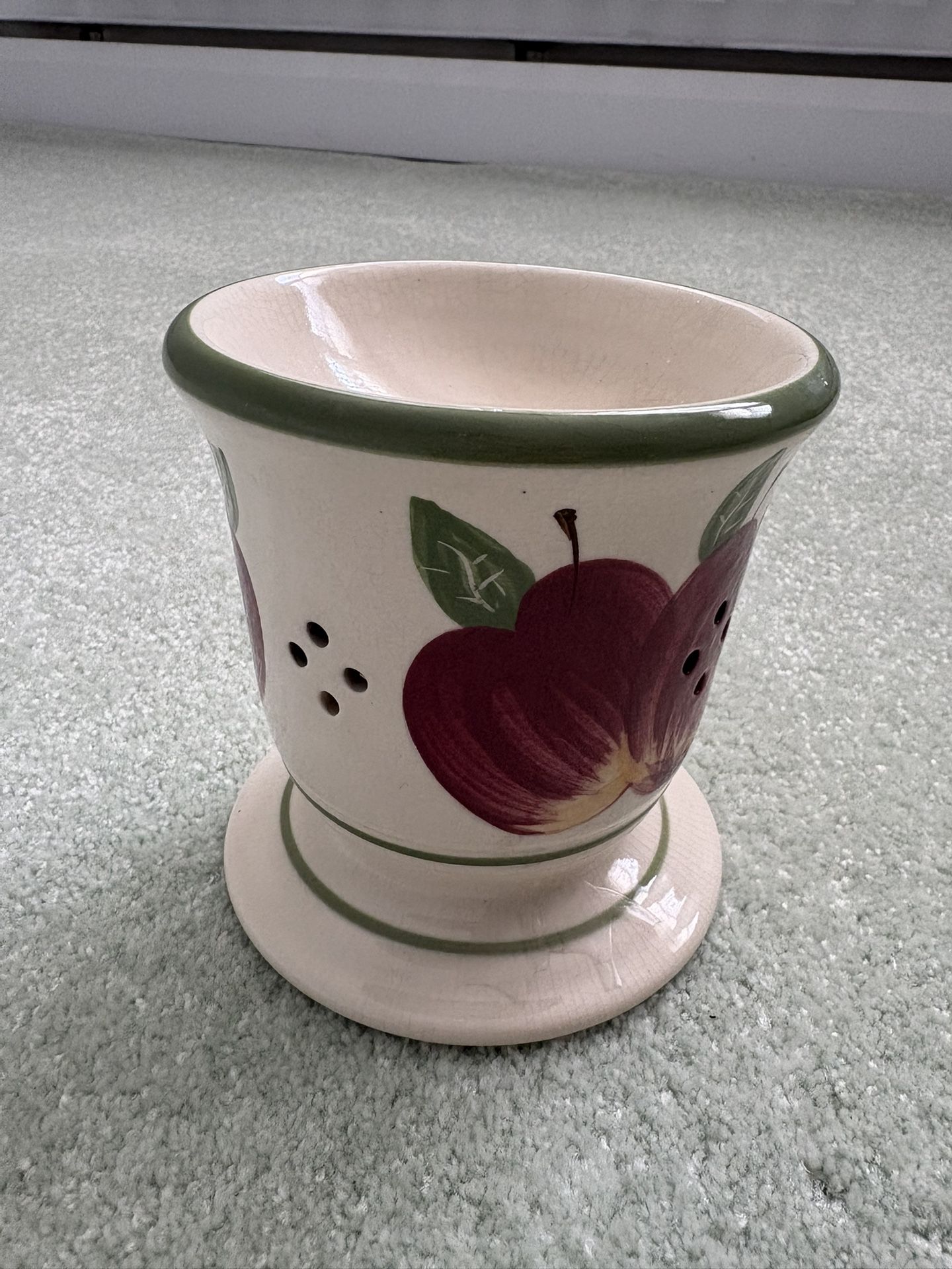 Tea light candle holder made of ceramic featuring an Apple pattern painted on it 5 inches tall