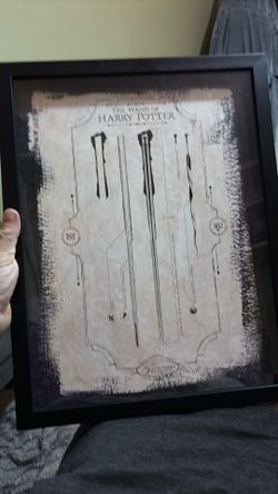 Alright, here's a draft you could use: This pristine Harry Potter art print features Ollivanders Wand Shop 382 BC in a black frame, completely in mint