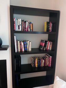 2 black wood bookshelves