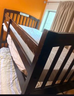 Bunk bed with ladder and mattress