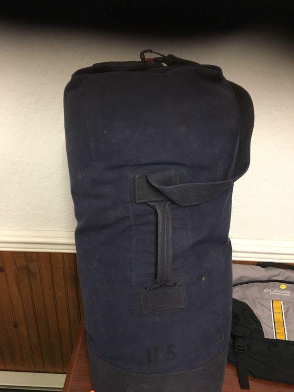 Navy bag with 2 new sleeping bags inside