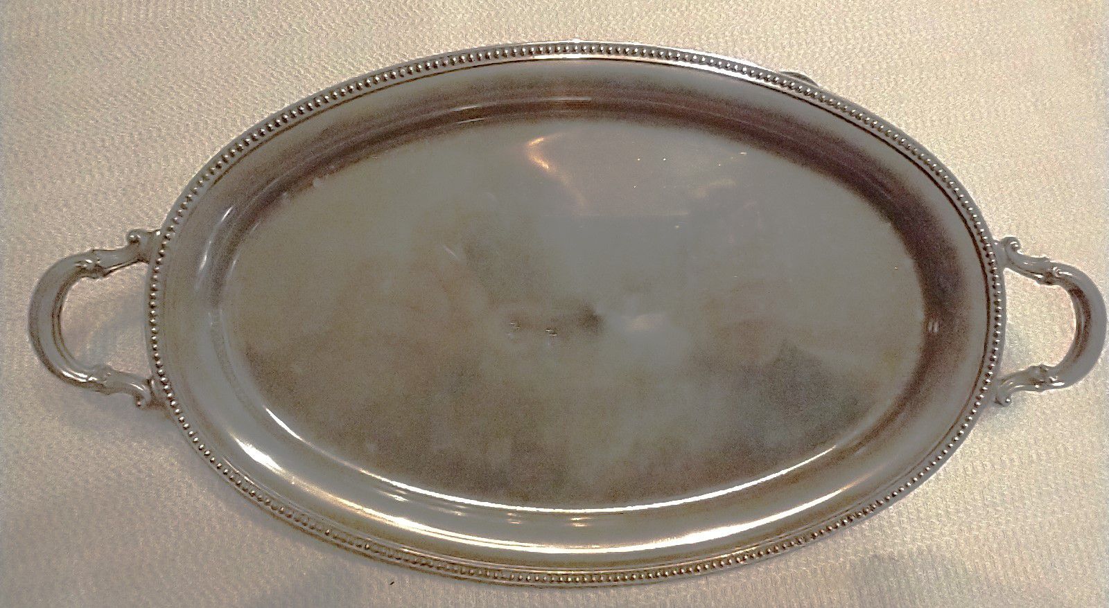 

Platter silver plated, 11.75” long x 6.25" wide--

