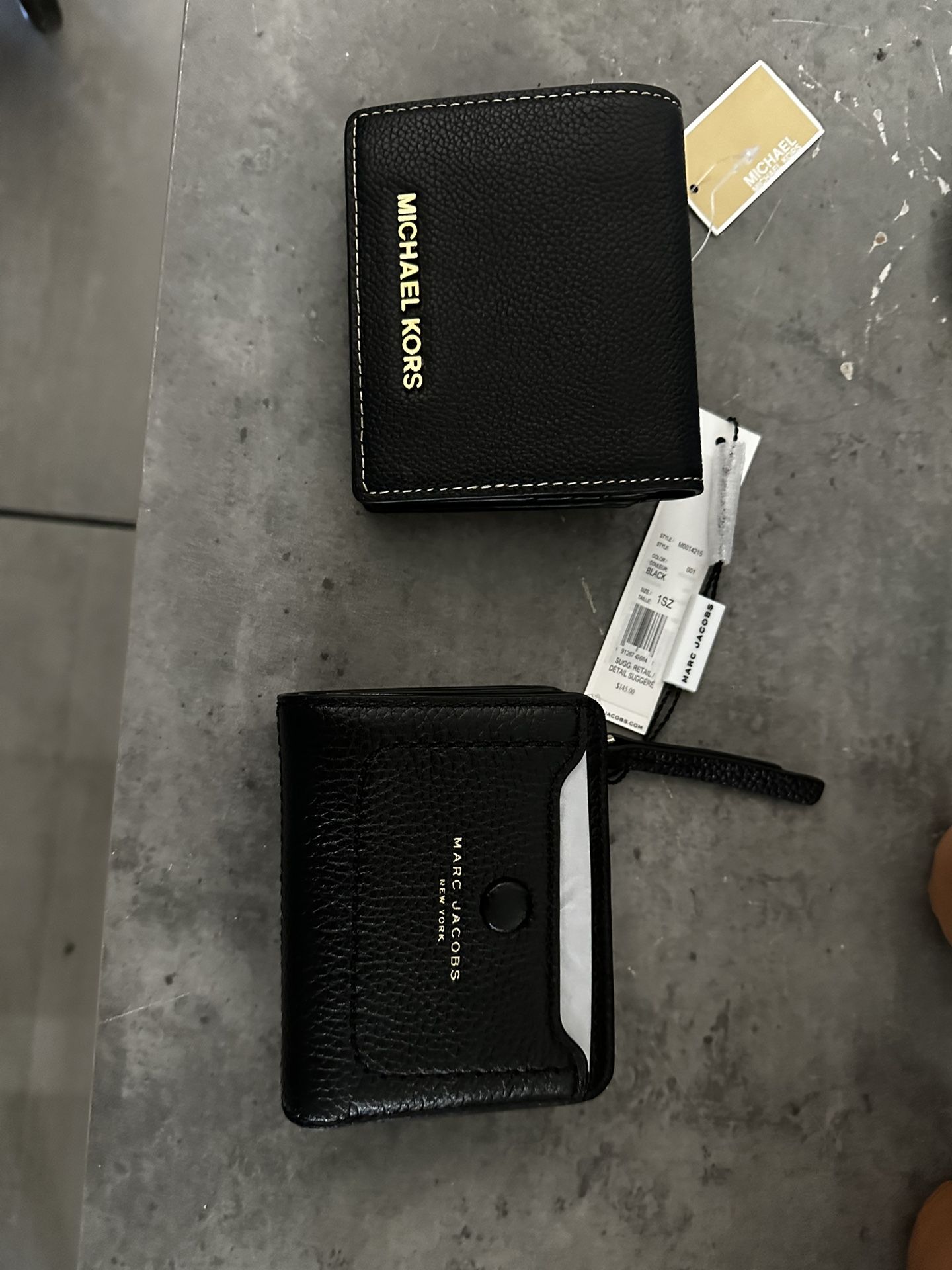 Micheal Kors and Marc Jacob’s wallets
