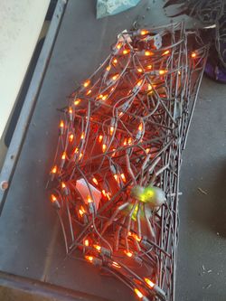 Halloween lights shaped like a spider web with spiders in them each section is 34 inches six panels