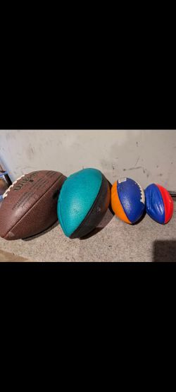 Wilson Football And 3 Smaller Balls