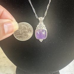 Beautiful 925 Sterling silver genuine amethyst necklace , chain is 18 in , fancy link marked Sterling, pendant marked ATI 925