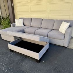 Gray Living Spaces Sectional Couch With Ottoman & Storage