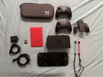 Switch 2 with 2 Pro Controllers and 2 games