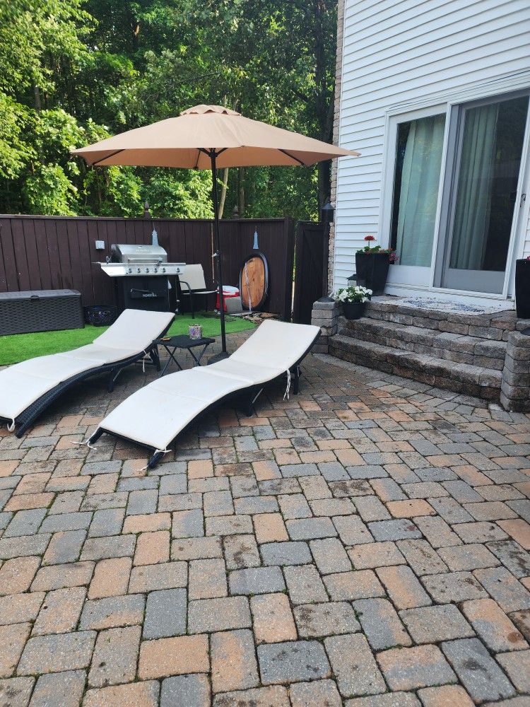 East Village Outdoor Wicker Lounge Chairs With Umbrella And Table