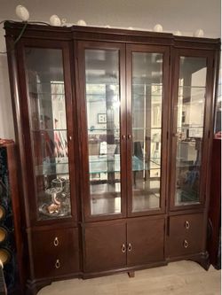 Macy’s collection Dining set with 6 chairs, curio, and cabinet.