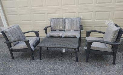 Outdoor patio wicker sofa with chairs and coffee table