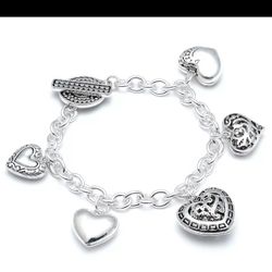 Amazing SILVER PLATED " HEARTS ON THE RUN" CHARMS BRACELET