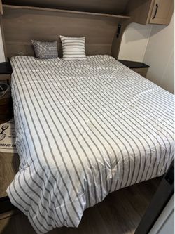 Queen size RV bed.  Brand new!  Still in plastic! With cover and pillows
