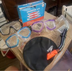 6 pcs Preowned & new items for swimming . Snorkel, masks , cap & swimming aid. Located off lake mead & Simmons area asking $10 for all