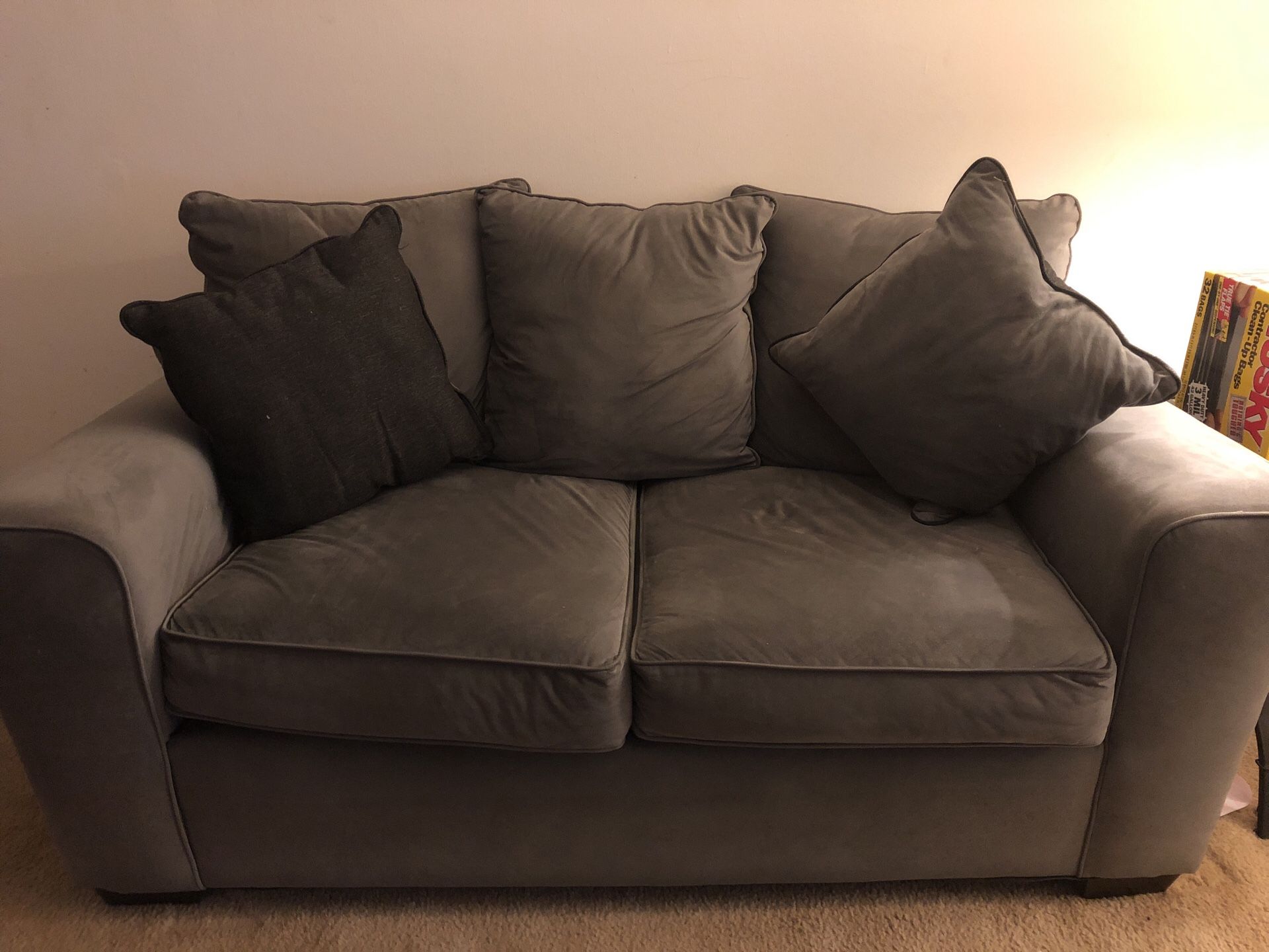 Grey Love seat with pillows